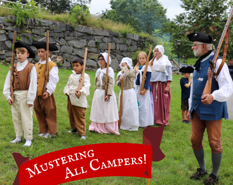 Mustering all Campers! Image of children in 18th century clothes lined up to perform a mustering drill.