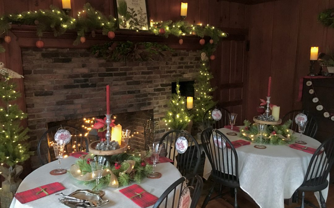 Two tables decorated for a winter holiday event.
