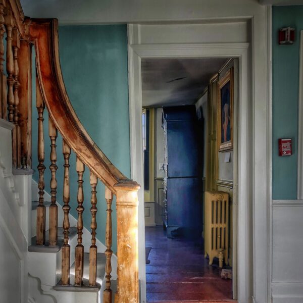 Architectural Tour Highlight of the main bannister, wooden railing with many spindles.