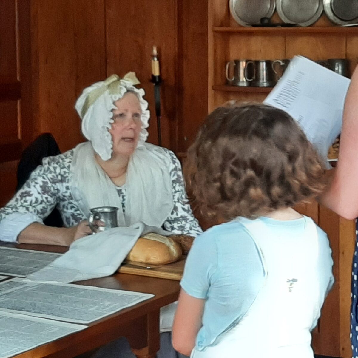 18th Century lady talking to child